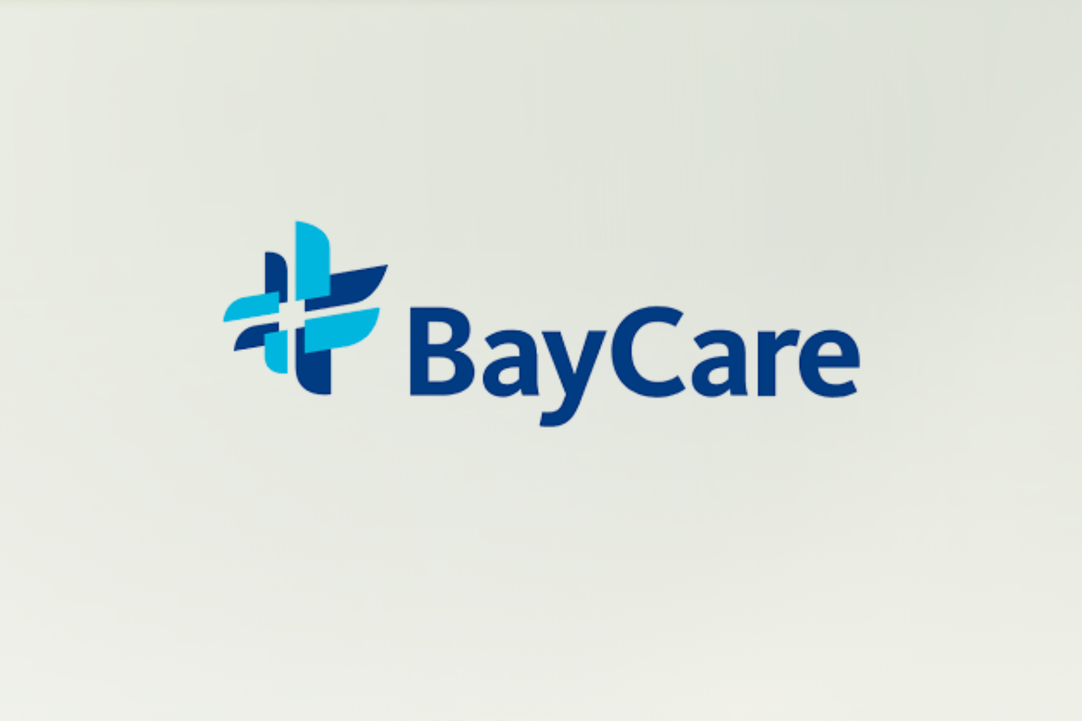 BayCare logo featuring a blue abstract cross design to the left of the word "BayCare" in bold blue letters on a light background.